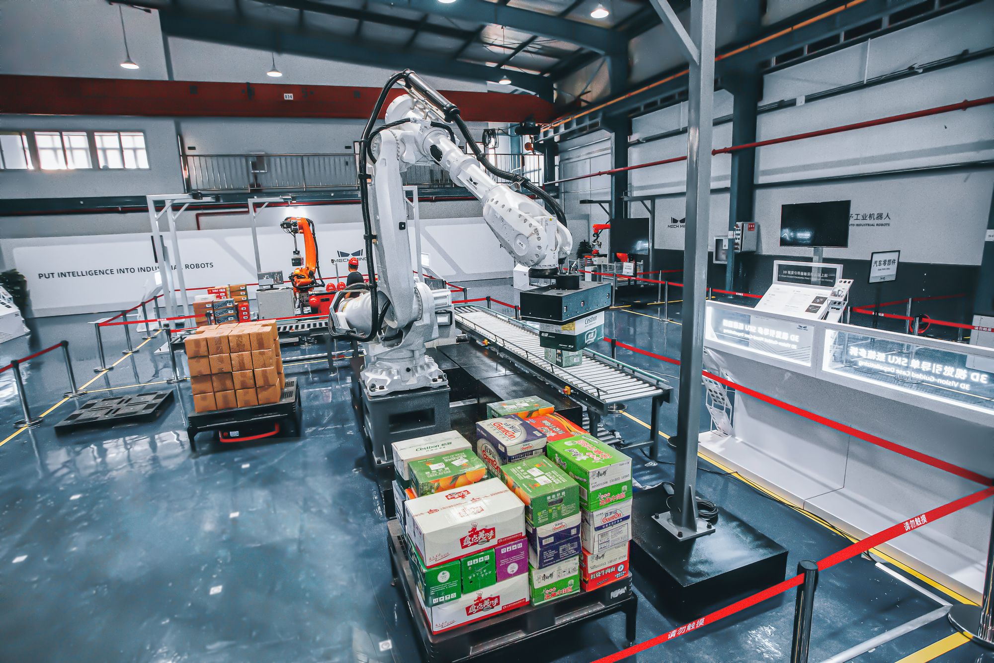Industrial robot arms on a manufacturing floor